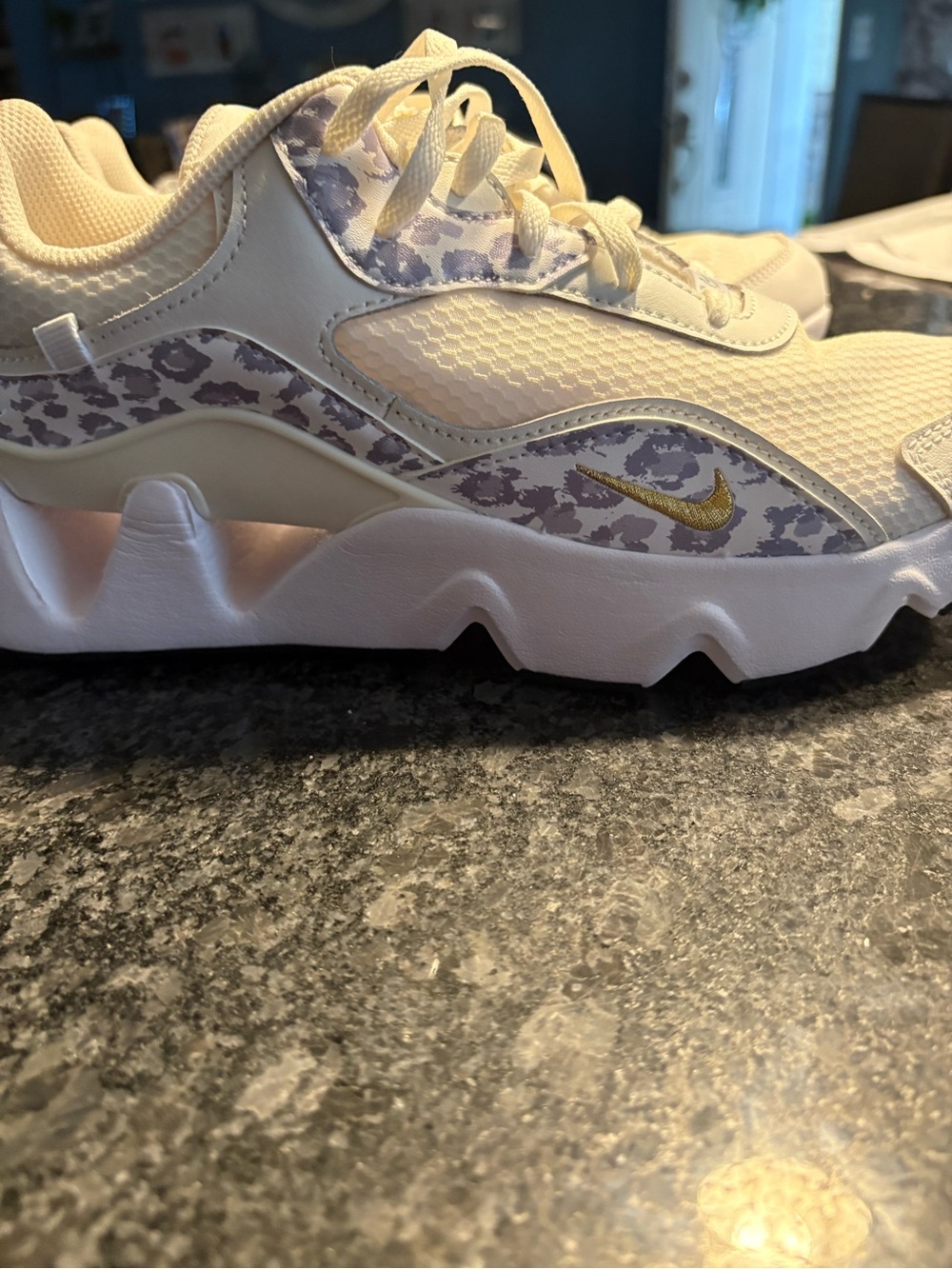 RYZ 365 Nike woman’s running shoe  Leopard and Gold Swoosh 9.5